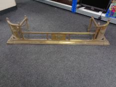 A brass Art Nouveau fire curb