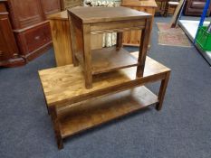 A contemporary coffee table with matching lamp table