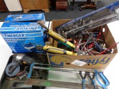 A box of hand tools, mitre saw, case of grinder,