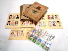 A box containing a very large quantity of cigarette cards in albums