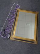A contemporary black and gilt bevelled mirror together with a boxed celebrations rope light sign