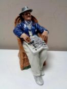 A Royal Doulton figure Taking Things Easy HN 2677