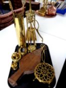 A tray of brass ammunition shell, companion set and pieces, trivet,