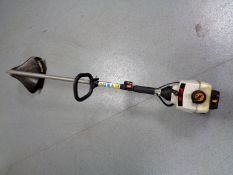 A Ryobi petrol strimmer