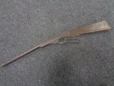 An early 20th century child's lever action toy rifle