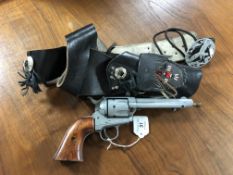 A replica Colt Single Action Army blank firing revolver with western style gun belt