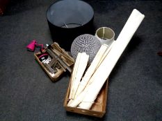 A contemporary standard lamp together with a box containing angle-poise lamp, LED lights,