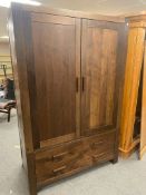 A contemporary wardrobe fitted two drawers beneath