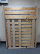 A contemporary pine 4'6 bed frame with mattress