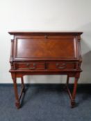 A contemporary fall front writing bureau fitted two drawers