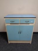 A mid 20th century kitchen cabinet