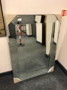 A plain all glass mirror 100 cm x 70 cm