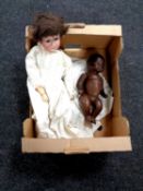 A bisque headed doll stamped Sebruder Heubach Germany together with one other doll stamped A M