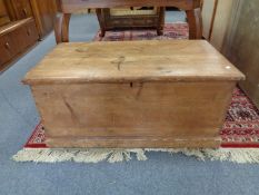 An antique pine blanket box