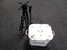 A contemporary metal companion set together with a vintage enamelled bread bin