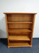 A contemporary CD cabinet together with an open bookcase