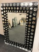 A contemporary all glass mirror 100 cm x 140 cm