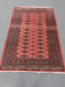 A Tekke rug on salmon ground,