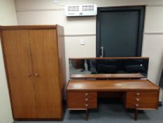 A three piece teak bedroom suite : mirror back dressing table,
