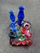 A tray containing two blue glass oil lamps, etched and coloured glassware including lidded bowl,