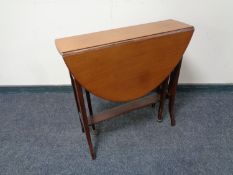 An Edwardian mahogany Sutherland table