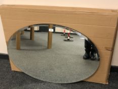 An oval plain glass mirror