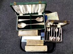 A tray containing a large quantity of boxed cutlery