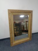A gilt and gesso bevelled edge over mantel mirror
