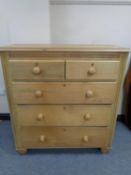 A pine chest of five drawers