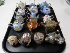 A tray containing six handmade De Rosa animal figures together with 12 assorted enamel,