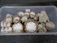 A box containing three antique and later china tea services