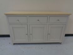 A triple door sideboard (metal handles)