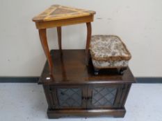 A Jaycee oak television stand together with a triangular musical occasional table and a tapestry