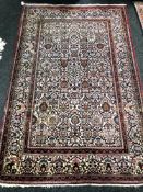 An early 20th century Kashan rug, central Iran, with lattice central field,