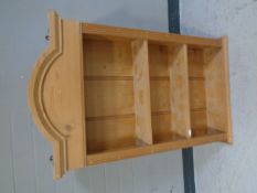 A set of wall mounted pine open shelves