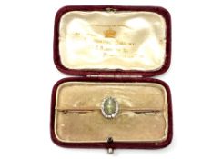 A rose gold diamond and cabochon stone bar brooch CONDITION REPORT: Indistinctly
