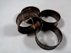 A set of four antique silver napkin rings