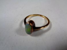 A gold opal ring (hallmarks rubbed)