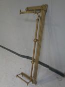 An antique brass fire fender