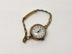 A 9ct gold cased lady's wristwatch signed Reid & Sons,