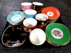 Six English bone china harlequin trios together with a further six Polish china harlequin trios