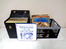 A case and a plastic crate containing vinyl LPs and 78s
