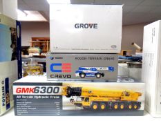A Grove GMK6300 all terrain hydraulic crane together with a Grove model YB5515 crane and a Crevo