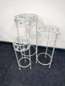Three graduated metal plant stands