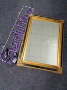 A contemporary black and gilt bevelled mirror together with a boxed celebrations rope light sign