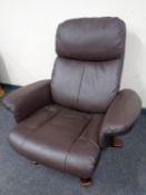 A brown leather recliner chair