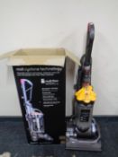 A Dyson DC33 Multi Floor upright vacuum with original box