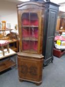 A walnut corner display cabinet