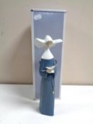 A Lladro figure of a nun with prayer book No.