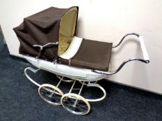 A mid 20th century Silver Cross doll's pram